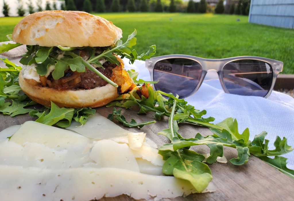 Gluten-free caramelized onion and Gruyère burgers on a toasted gluten-free bun